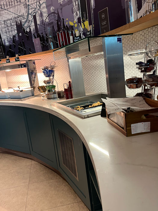 Aspire Lounge Terminal 2 Manchester Airport bar area with wines, beers and coffee machine